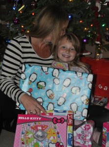 Jessica's mom, Andrea, kisses her daughter as she shares her story of giving to those in need. Photo by Meagan Friberg.