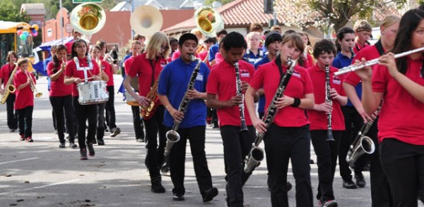 The Flamson marching band plays for the crowd.
