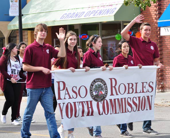 Members of the Paso Robles Youth Commission proudly display their banner along the parade route.