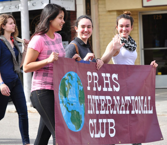 PRHS International Club members wave to onlookers.