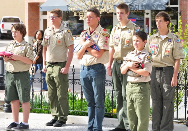 PR Scout Troop 60 members prepare to lift & install the new city flags.