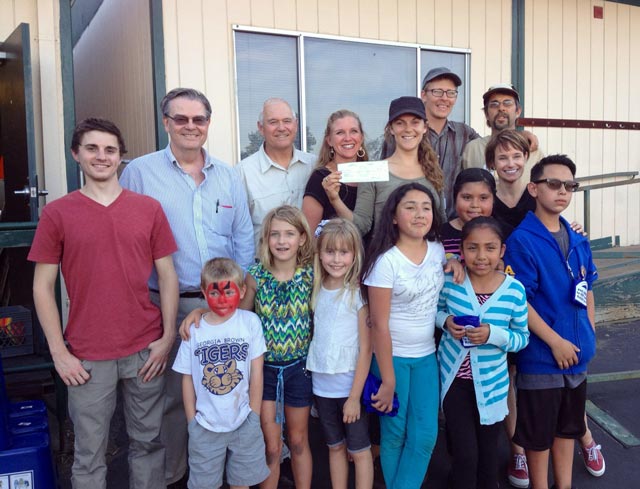 Adults in the photo from left to right: Michael Scott, a Cal Poly intern who co-wrote the application for the school, Paso Robles City Councilman Steve Martin, SLO County Supervisor Frank Mecham, Georgia Brown Principal Ellalina Emrich-Keller, Victoria Carranza of One Cool Earth and USGBC Green Schools Co-Chair, Greg Ellis-Valencia of One Cool Earth, Mike Swettenam, Georgia Brown Garden Coordinator, Jen McIntyre, IWMA county recycling coordinator and USGBC Green Schools co-chair. Students In the picture are compost and recycling monitors, gardeners, and eco heroes.