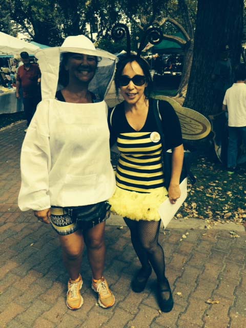 A beekeeper on the left and Jenni Cisco as a bumblebee at last year's festival.