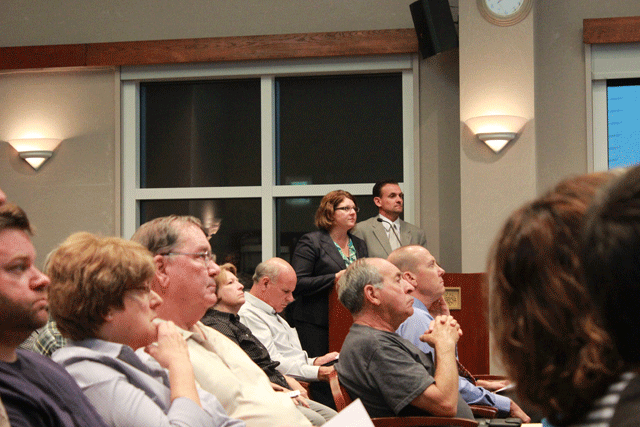 Visit San Luis Obispo County CEO Stacie Jacob and Senior Director Chuck Davison, at lecturn, present their request for Paso Robles to join the county's tourism marketing district. Photo by Heather Young