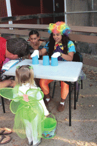 Volunteers run games at Zoo Boo at Charles Paddock Zoo. Photo by Heather Young