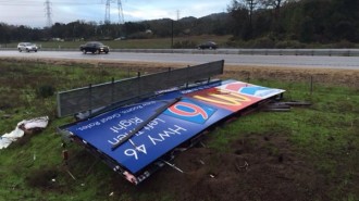 wind knocks billboard down