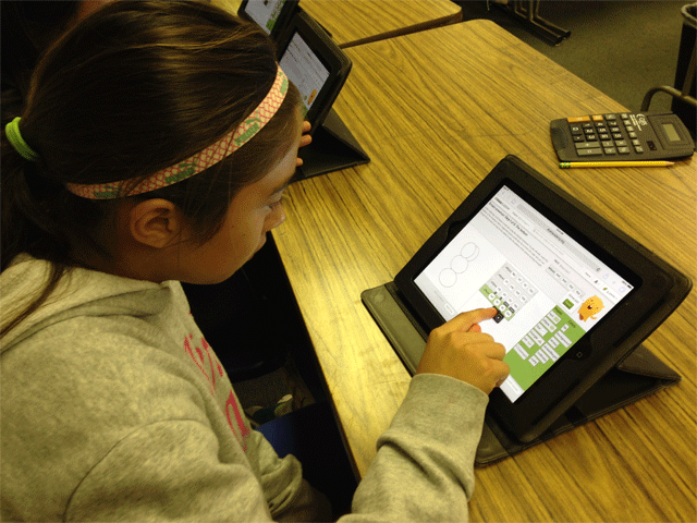 A sixth grader at Lillian Larsen school in San Miguel uses an iPad to participate in the Hour of Code initative.