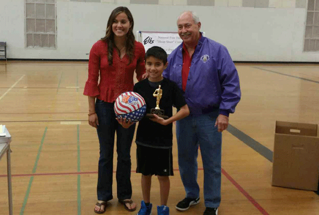 Julian Gallardo, center, stands with his first place trophy and basketball. He took first in both the Paso Robles Elks Lodges and district Hoop Shoot. He will go on to the state competition on Saturday, Feb. 7.