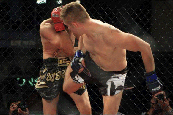 Castle Williams, front, takes on a mixed martial arts opponent in 2014.