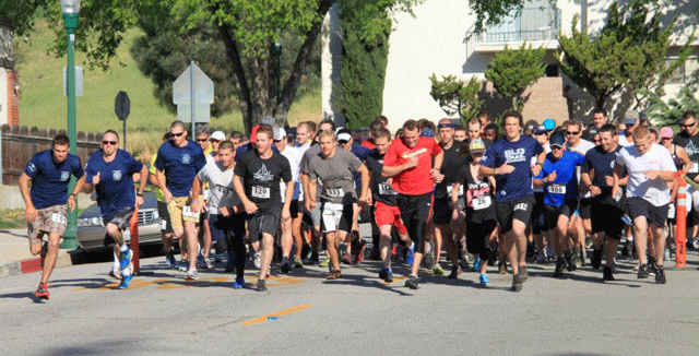 The 2014 Firehouse 5K Fun Run begins.