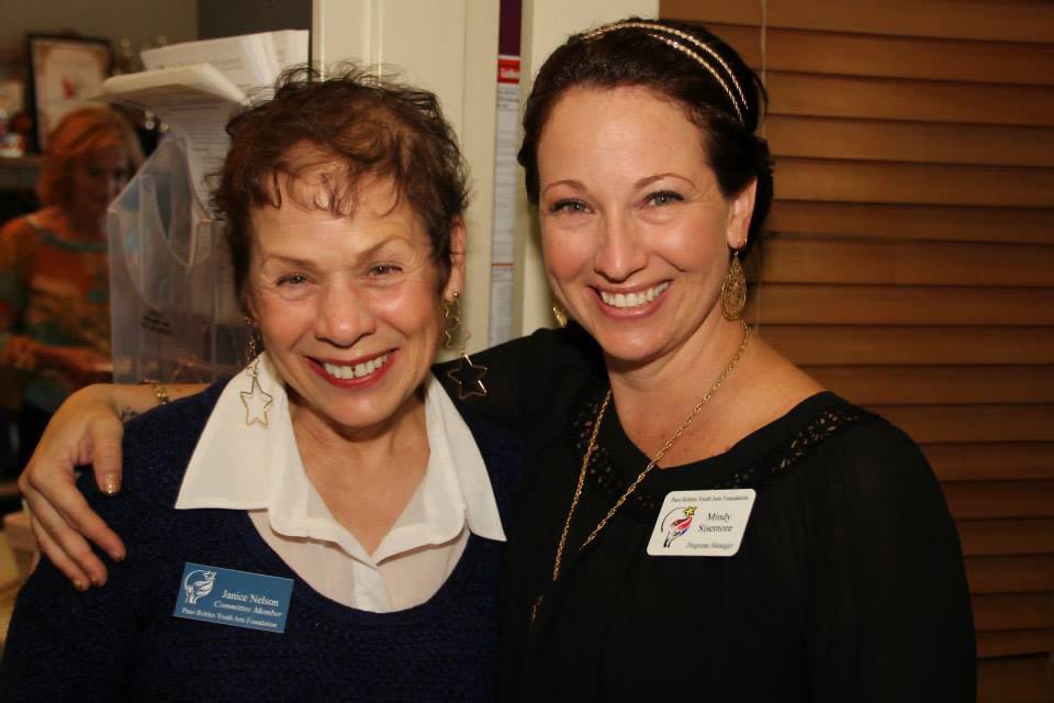 Mindy Sisemore, featured on the right with her arm around volunteer Janice Nelson.