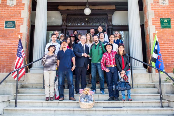 Mayor Steve Martin and the Mayor of Gaiole, Italy, Michele Pescini, and his entourage pose on the steps of the Carnegie Library in downtown Paso Robles. Photo courtesy of Asia Croso.
