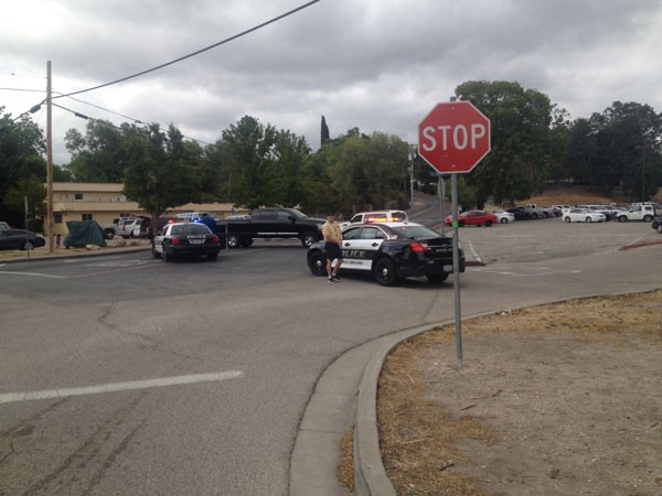 Police cars block access to the high school campus. Photo by Paula McCambridge.