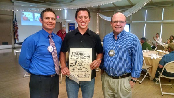 Atascadero Rotary Club President John Hollenbeck and Atascadero Rotary Club Member Ryan McGaughey present a sponsorship check to Atascadero Firefighter Matt Miranda to support the Atascadero Firefighter's Association Firehouse 5K Run and Health Fair.