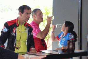 Great Western Bicycle Rally participants taste some wine at Brecon Estate on Saturday on the wine ride led by Bill Haas. Photo by Heather Young