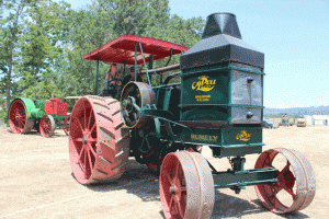 Paso Robles Daily News writer Heather Young drives a 1912 Rumely oil pull with 60 horse power at Santa Margarita this week.