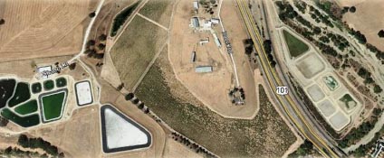 Above: The Meadowbrook Wastewater Treatment Plant (lower left hand corner) treats effluent collected from the West side of Templeton. Once the wastewater has finished treatment, it is pumped under the freeway to the district’s percolation ponds (lower right hand corner) where the water filters down through the sands and gravels of the Salinas River and joins the underflows. Photo © Google Earth.