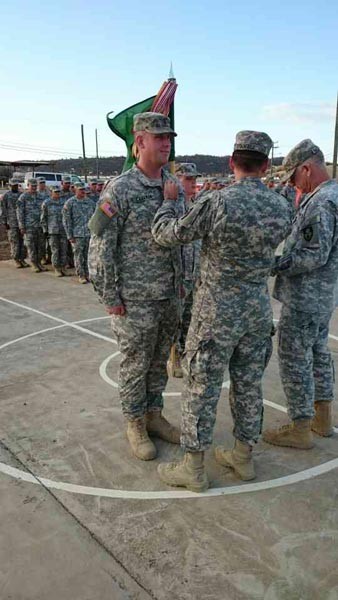 First Lieutenant Cameron receiving an Army Commendation Medal from his commander. Courtesy photo.