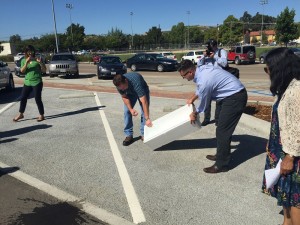 Engineers perform a demonstration showing the difference between asphalt and pervious materials. Photo by Paula McCambridge