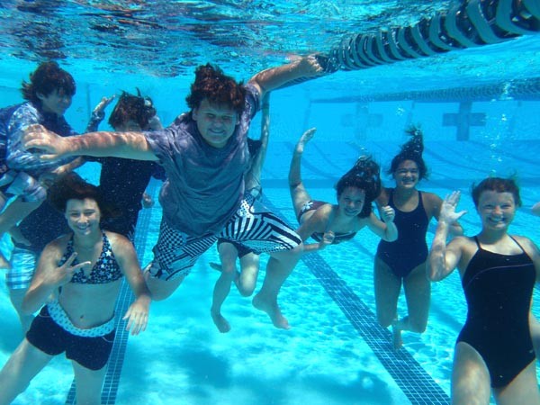 junior lifeguards taking a break underwater