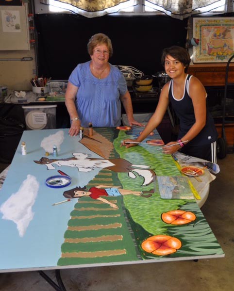 Artist Brenda Thomason with student art contest winner Santana Sanchez.