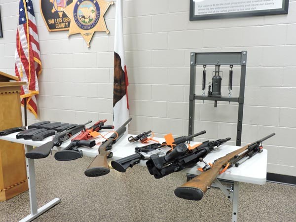 Semi-automatic rifles, handguns, and ammunition were also confiscated.