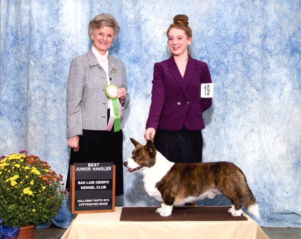 AKC Judge Florence Males presents the award for Best Junior Handler in 2013 to Hannah Firchow. Firchow handled Conifer Stuck on You , aka Linus. Courtesy photo.