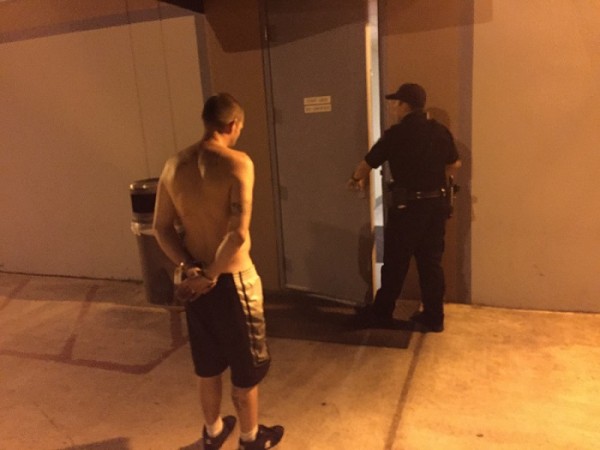 Atascadero Police Officer Sam Rodriguez arrests a male for DUI on Sunday. Photo by Paula McCambridge