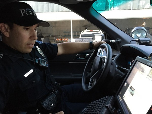 Atascadero Police Officer Sam Rodriguez prepares to start his night shift at the station Sunday. Photo by Paula McCambridge
