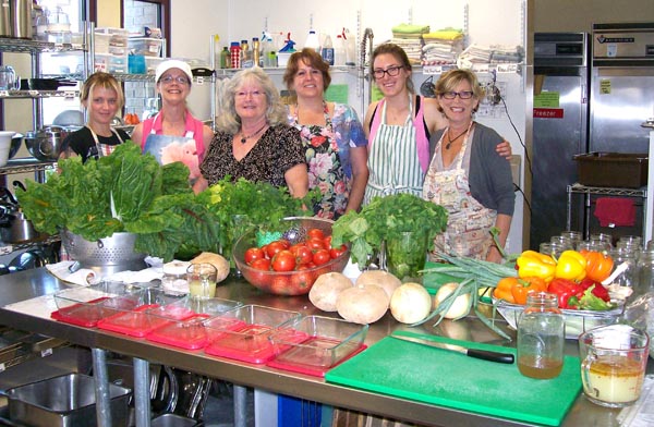Volunteers preparing nutritious food for the Wellness and Healing Foods programs. Courtesy photo.