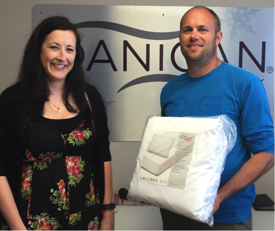Resident Services Coordinator for HASLO Traci Walker receives donations of Danican Care Packages from Thomas Frismodt, CEO of Danican. Courtesy photo.