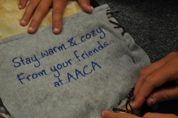 One of the blankets with a pocket being sewn during crafting class in middle school electives by Zoe Smith, a 5th grader.