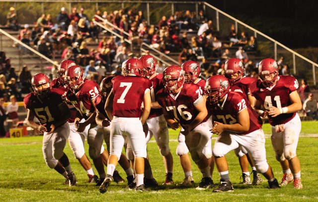 Quarterback Justin Davis, center, calls out the plays during Paso Robles' 30-0 shut-out win over Righetti last week. Davis and his fellow Paso Robles High School Bearcats will host the rival Atascadero Greyhounds on Friday, Nov. 6 at War Memorial Stadium. JV action starts at 4 p.m., with the Varsity players taking the field at 7 p.m. Photo by Meagan Friberg