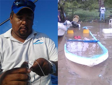 Valentine (left) and his sunken boat.