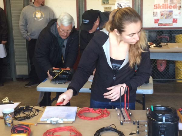 Melissa Perozzi pre-checks testing material in electronics test. Photo by Dick Mason.
