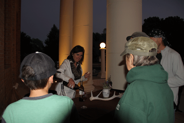 Debbie Arnold, Fifth District supervisor, pours her family's wine, Vintage Cowboy, on Friday. Photo by Heather Young