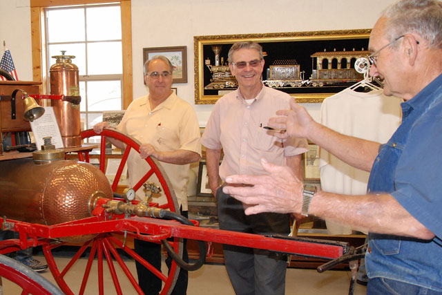 Atascadero Mayor Tom O’Malley, at left, and Paso Robles Mayor Steve Martin, center, listen as Daryl Radford describes the antique fire wagon displayed in the restored Templeton Train Depot. Martin and O'Malley support many local activities jointly and refer to themselves as “Dos Alcaldes”, Spanish for “two mayors." They even have their own website at www.DosAlcaldes.com.