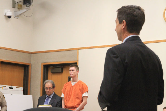 Bret Landen, center in orange, with his attorney, Jeffrey Stein, at his side. Deputy District Attorney Matt Kraut in the foreground addressing Judge John Trice on Wednesday. Photo by Heather Young