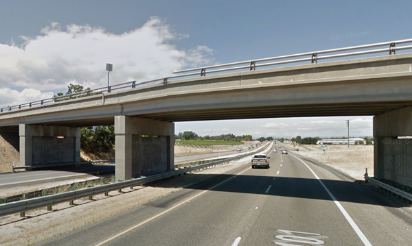 The vehicle struck the metal guardrail and then the concrete column that supports the Main Street overpass.