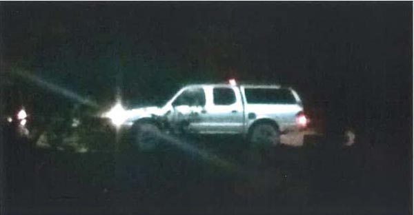 A witness was able to take a photograph of one of the vehicles leaving the area. The vehicle is a silver 2000-2004 Toyota Tacoma truck with a silver camper shell and black matte rims and tinted windows.