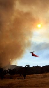 Cal Fire tanker drops fire retardant near Running Deer