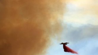 Cal Fire tanker drops fire retardant near Running Deer