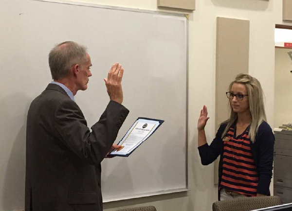Catherine Piatti getting sworn in by Paso Robles City Manager Tom Frutchey.