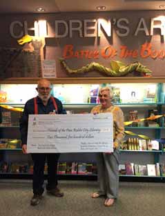 Tom Erwin of Masonic Lodge #196 presented Friends of the Library Anne Belle with a check for $2,500 Student browses new collection of Battle of the Books titles Paso Robles Joint Unified School District Superintendent Chris Williams joins Mayor Steve Martin at the Library during a ribbon-cutting ceremony to official open nearly 400 new Battle of the Books collection materials.