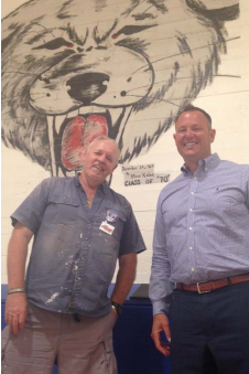 Superintendent Chris Williams and local artist and alumnus Steve Kalar.