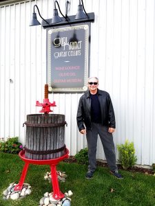 Gary Kramer out front at his new "Cheers"-style Guitar Cellars.