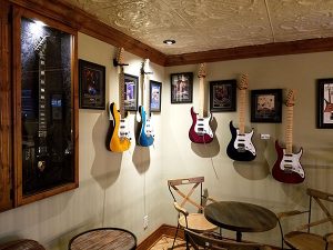 Guitar memorabilia in the second floor lounge at Gary Kramer Guitar Cellars.