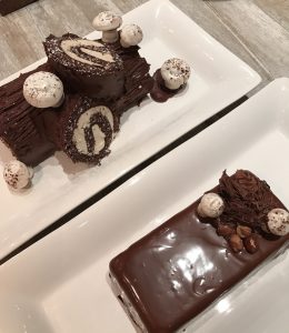 Two cakes - the classic yule log and the contemporary brick shape