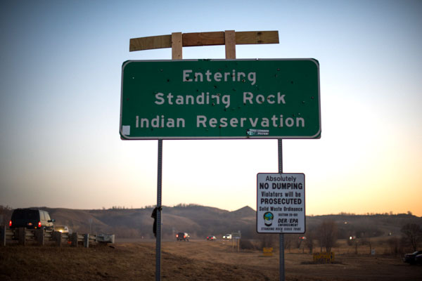 San Luis Obiso County photographer Brittany App captured the bullet-holed sign upon entering Standing Rock.