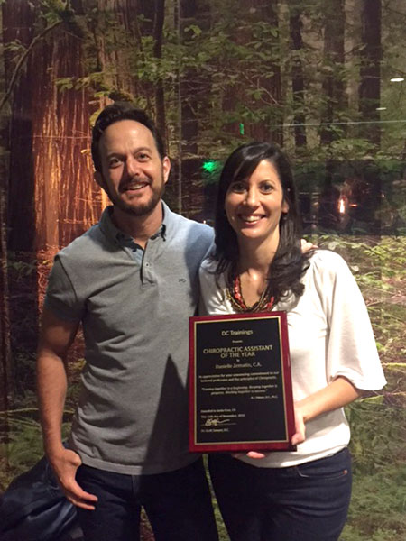 Dr. Darren Hart congratulates Danielle Zemaitis on her award.